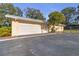 Attached garage with automatic door opener and ample parking at 10406 Lakeshore Dr, Clermont, FL 34711