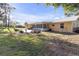 Ranch home with large backyard and screened porch at 10406 Lakeshore Dr, Clermont, FL 34711