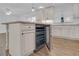 Kitchen island with built-in wine cooler at 10406 Lakeshore Dr, Clermont, FL 34711
