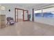 Bright living room with large windows and tiled floors at 10406 Lakeshore Dr, Clermont, FL 34711