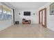 Spacious living room with wood-look floors and ample natural light at 10406 Lakeshore Dr, Clermont, FL 34711
