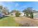 Property with grassy backyard and partial home view at 11 Orangewood Dr, Fruitland Park, FL 34731