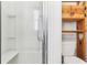 Bathroom with shower, toilet, and additional shelving at 11 Orangewood Dr, Fruitland Park, FL 34731