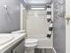 Bathroom with tub, shower, and gray vanity at 11 Orangewood Dr, Fruitland Park, FL 34731