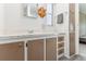 Bathroom with taupe vanity, and a large mirror at 11 Orangewood Dr, Fruitland Park, FL 34731
