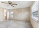 Spacious bedroom with ceiling fan, neutral carpeting, and window blinds at 11 Orangewood Dr, Fruitland Park, FL 34731