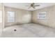 Bright bedroom with ceiling fan, neutral carpeting, and window blinds at 11 Orangewood Dr, Fruitland Park, FL 34731