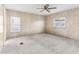 Bright bedroom with ceiling fan, neutral carpeting, and window blinds at 11 Orangewood Dr, Fruitland Park, FL 34731