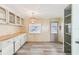Dining area with built-in cabinets and hardwood floors at 11 Orangewood Dr, Fruitland Park, FL 34731