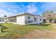 Home's exterior showcasing a screened porch at 11 Orangewood Dr, Fruitland Park, FL 34731