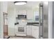 Kitchen with white cabinets and stainless steel appliances at 11 Orangewood Dr, Fruitland Park, FL 34731