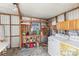 Laundry room with washer, dryer, and ample storage at 11 Orangewood Dr, Fruitland Park, FL 34731