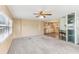 Spacious living room features a ceiling fan and an open floor plan at 11 Orangewood Dr, Fruitland Park, FL 34731