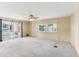 Large living room with wall-to-wall carpeting and sliding glass doors at 11 Orangewood Dr, Fruitland Park, FL 34731