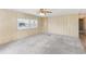 Bright living room with wall-to-wall carpeting and neutral decor at 11 Orangewood Dr, Fruitland Park, FL 34731