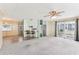Spacious living room with hardwood floors and access to a sunroom at 11 Orangewood Dr, Fruitland Park, FL 34731