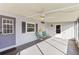 Relaxing screened porch with ceiling fan and comfortable seating at 11 Orangewood Dr, Fruitland Park, FL 34731
