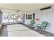 Bright and airy screened porch with ceiling fan and patio furniture at 11 Orangewood Dr, Fruitland Park, FL 34731