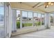 Sunroom with tiled floor, large windows, and a view at 11 Orangewood Dr, Fruitland Park, FL 34731