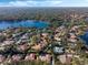 Aerial view of lakefront homes and lush landscape at 1286 Prince Ct, Lake Mary, FL 32746