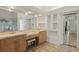 Double vanity bathroom with a large mirror and built-in shelving at 1286 Prince Ct, Lake Mary, FL 32746