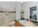 Bathroom with shower, toilet, and colorful tile at 1286 Prince Ct, Lake Mary, FL 32746