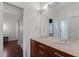 Double vanity bathroom with marble countertops and wood cabinets at 1286 Prince Ct, Lake Mary, FL 32746