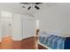 Bright bedroom with hardwood floors and a built-in closet at 1286 Prince Ct, Lake Mary, FL 32746