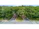 Community entrance with tree-lined paths and brick roads at 1286 Prince Ct, Lake Mary, FL 32746