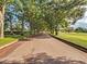 Tree-lined street leading to golf course at 1286 Prince Ct, Lake Mary, FL 32746