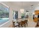 Casual dining area with glass table and view of the pool at 1286 Prince Ct, Lake Mary, FL 32746