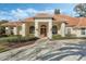 Inviting one-story home with a tile roof and lush landscaping at 1286 Prince Ct, Lake Mary, FL 32746