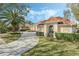 Landscaped yard with a curved driveway leading to a house at 1286 Prince Ct, Lake Mary, FL 32746