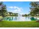 Circular pond with water fountain and lush landscaping at 1286 Prince Ct, Lake Mary, FL 32746