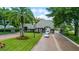 Gated entrance to a community with lush landscaping at 1286 Prince Ct, Lake Mary, FL 32746