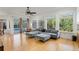 Gathering room with hardwood floors, large windows, and access to the pool area at 1286 Prince Ct, Lake Mary, FL 32746
