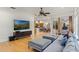 Gathering room with hardwood floors, a large TV, and pool access at 1286 Prince Ct, Lake Mary, FL 32746