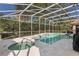Inviting pool and spa area with screened enclosure at 1286 Prince Ct, Lake Mary, FL 32746