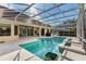 Resort-style pool with covered patio and lush landscaping at 1286 Prince Ct, Lake Mary, FL 32746