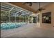 Spacious covered patio overlooking the refreshing pool at 1286 Prince Ct, Lake Mary, FL 32746