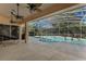 Relaxing poolside patio with ceiling fans and comfy seating at 1286 Prince Ct, Lake Mary, FL 32746