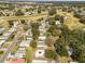 Aerial view of home in community near golf course at 1404 Torrey Pines Dr, The Villages, FL 32159