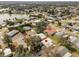 Aerial view of home near lake and golf course at 1404 Torrey Pines Dr, The Villages, FL 32159