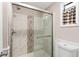 Updated bathroom with a large walk-in shower at 1404 Torrey Pines Dr, The Villages, FL 32159