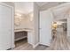 Double vanity bathroom with granite countertop and updated fixtures at 1404 Torrey Pines Dr, The Villages, FL 32159