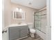 Modern bathroom with gray vanity and a tub shower combo at 1404 Torrey Pines Dr, The Villages, FL 32159