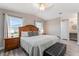 Spacious main bedroom with wood furniture and large windows at 1404 Torrey Pines Dr, The Villages, FL 32159