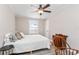 Comfortable bedroom with ceiling fan and ample natural light at 1404 Torrey Pines Dr, The Villages, FL 32159