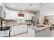 Updated kitchen featuring granite countertops and stainless steel appliances at 1404 Torrey Pines Dr, The Villages, FL 32159