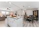 Open concept kitchen with island, granite countertops and breakfast area at 1404 Torrey Pines Dr, The Villages, FL 32159
